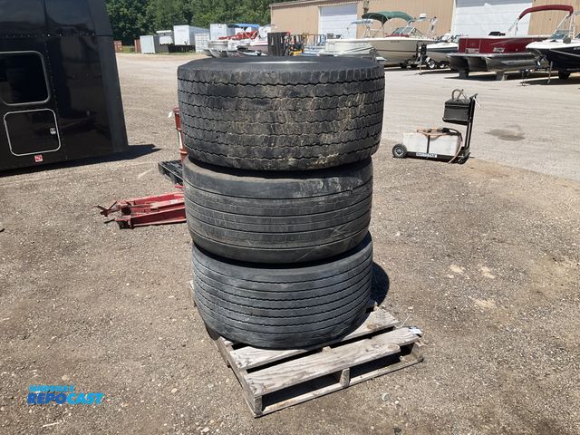 Lot 2-11968 - (3) 445/50R22.5 super singles on aluminum wheels, two tires are good and one is damage and unusable