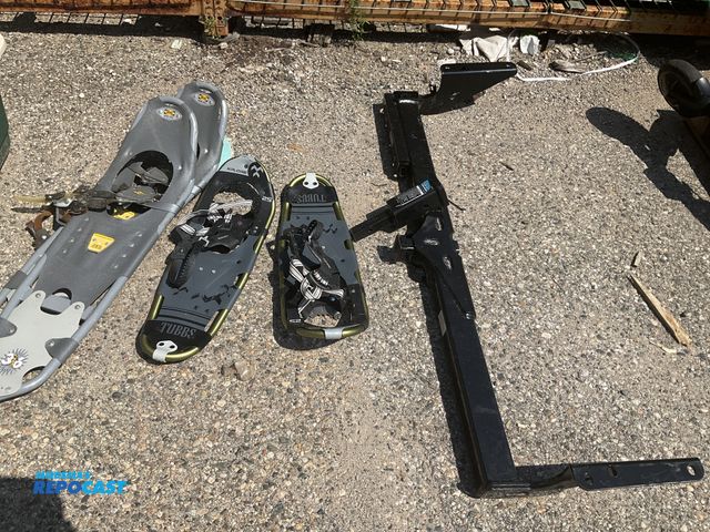 Lot 2-99802 - (2) pairs or snow shoes brands atlas and xplore and a 1-1/4” to 2” hitch adapter