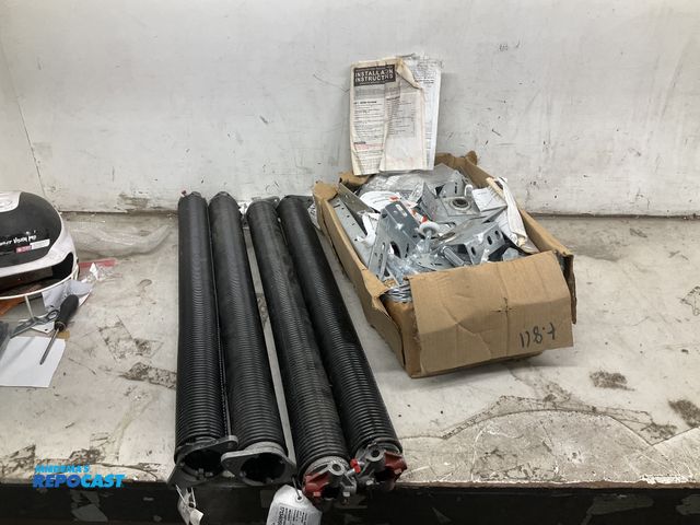 Lot 2-69493 - Lot of garage door parts, including garage door installation insert kits, and garage door torsion sp...