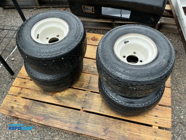 Lot 2-27797 - Lot of (4) golf cart rims and tires, measures 18” x 8.50”.