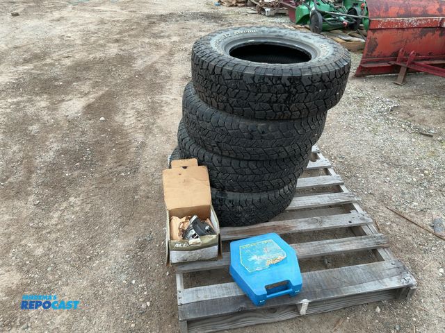 Lot 2-67777 - Set of (4) Hankook Dynapro 235/75R15 Tires, tire chains, &amp; an ACDelco generator.