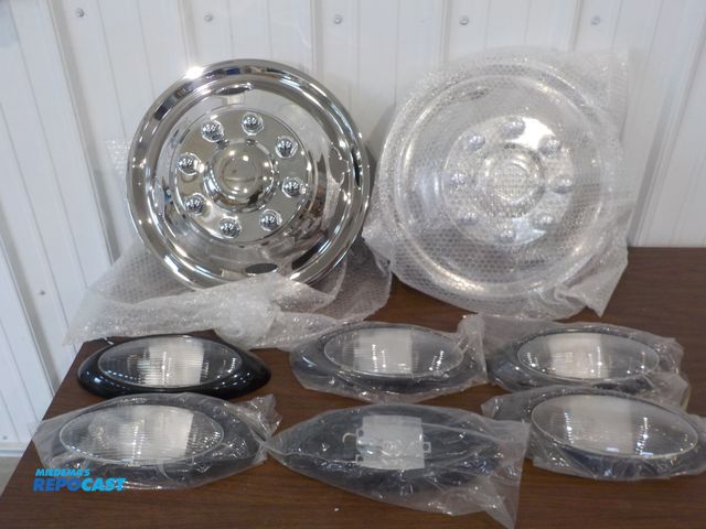 Lot 2-16269 - (2) new 15" rim covers, (6) Bezel lights, 12" width