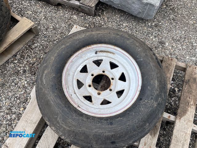 Lot 2-72725 - Used Carlisle USA Trail trailer tire and rim, 225/75D15