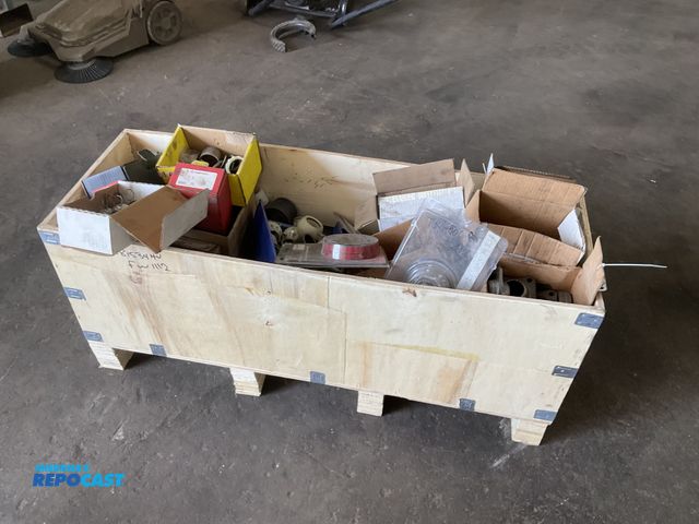 Lot 2-11942 - Box of misc truck parts including slack brackets, bushings, bearings, seals and more, new old stock