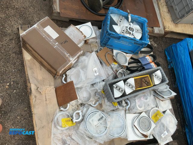Lot 2-18054 - Skid lot of industrial items including jaw chucks, belts, metal round clamps, and more