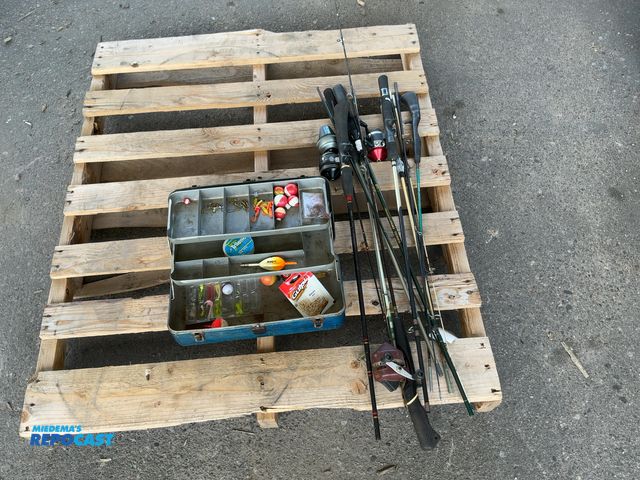 Lot 2-75063 - Lot of various fishing poles and a tackle box with lures, bobbers, and more