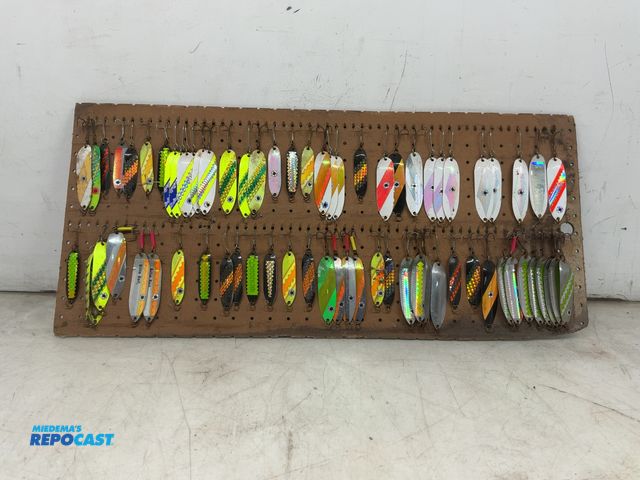 Lot 2-69593 - Board of many various fishing lures