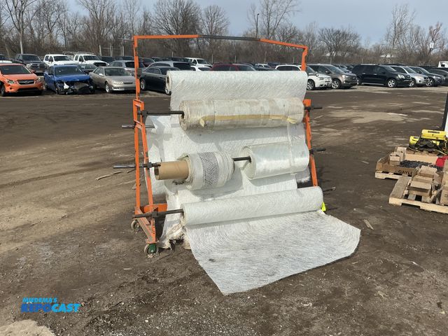 Lot 2-19862 - Large rollable rack of heavy duty rolls of fiberglass cloth for watercraft