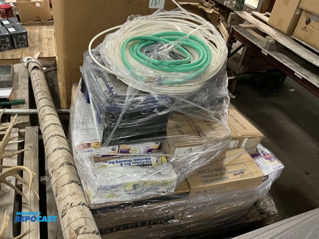 Lot 2-27289 - Skid lot of various Plumbing supplies including pipes, lights, and more