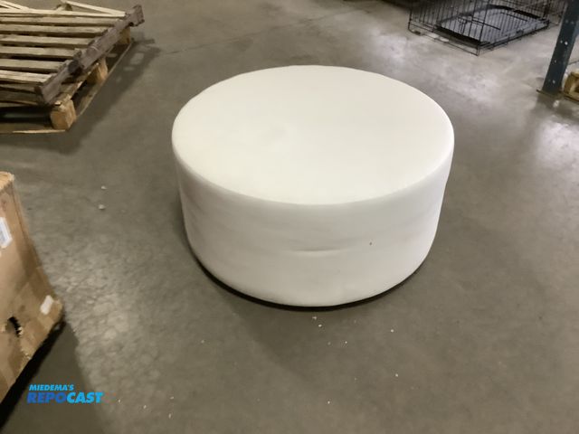 Lot 2-63158 - Howard Elliot white footstool. Measures 36” diameter.