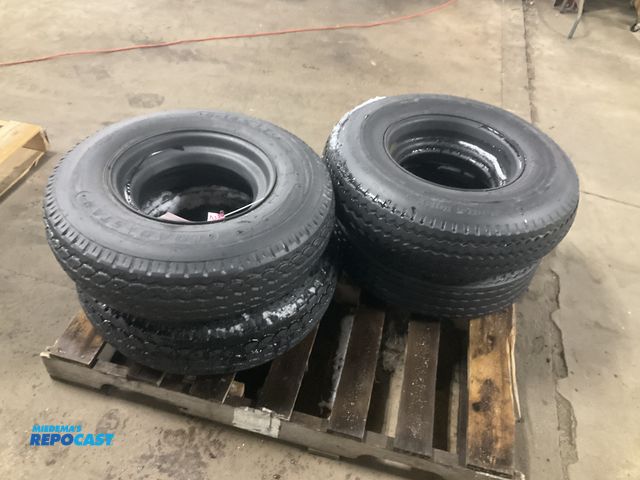 Lot 2-23814 - (4) 8-14.5 tires on steel mobile home style wheels, one tire is flat/off the bead, used
