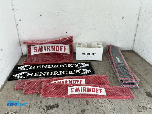 Lot 2-96765 - Lot of Smirnoff and Hendricks barware including (9) Smirnoff mats, (2) Hendricks mats, and a napkin ...