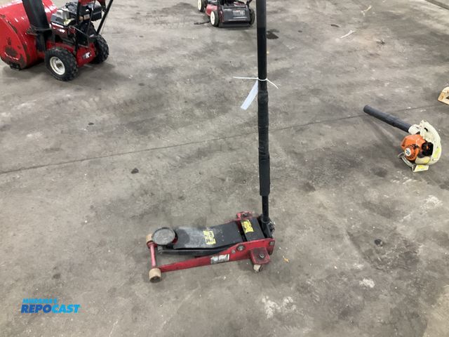 Lot 2-33171 - Low-profile floor jack, only raises a few inches and stops, needs work/repair