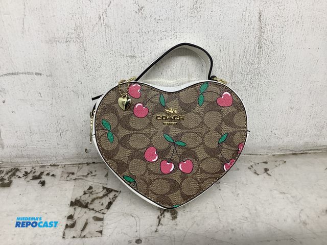 Lot 2-74003 - New Coach heart crossbody bag, features brand’s iconic signature canvas with cherry print