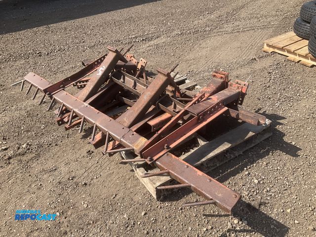 Lot 2-22731 - Skid of spike drag harrow parts and brackets, one tool bar with spikes approx 94”L, one approx 90” a...