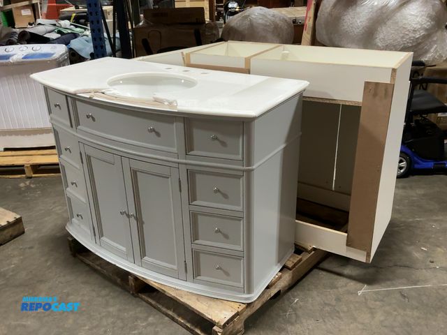 Lot 2-36790 - Lot of (2) Bathroom Vanity Cabinets. One has broken countertop, the other has damage at the base.