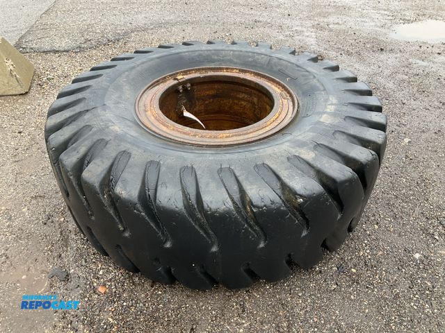 Lot 2-41554 - (1) 18.00-25 tire on steel split rim, used, scattered cracking and wear