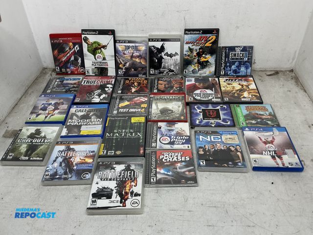 Lot 2-93357 - Box of PlayStation Games, Some Include Battlefield, Call of Duty, NHL16, Tomb Raider 2, Hot Pursuit,...