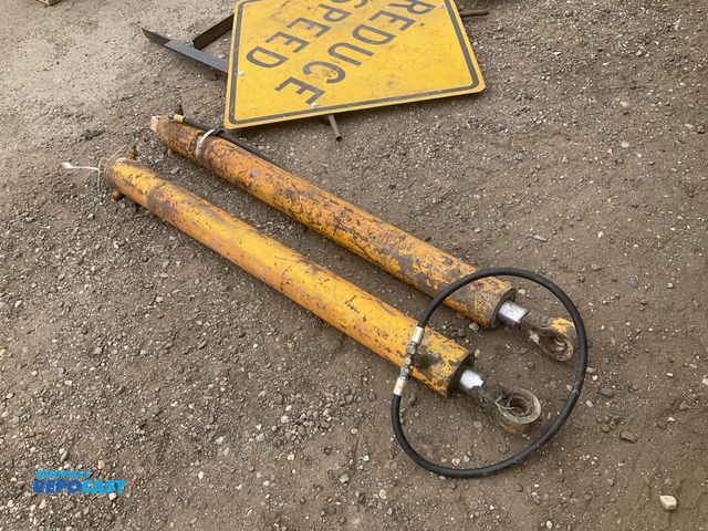 Lot 2-43422 - (2) hydraulic cylinders approx 60” center of pin to center of pin, 1-1/2” pin holes, used