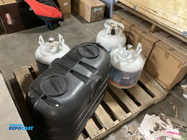 Lot 2-33248 - Skid lot of 3 propane tanks flaming king 20lb and a black dual propane cover