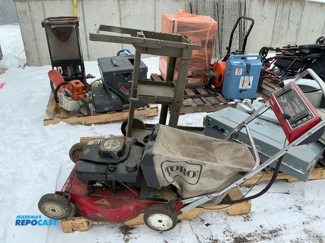 Lot 2-17059 - Skid lot of Toro Recycler Push Lawn Mower model #20211 serial #1002483 and a plastic Rubbermaid 3-le...