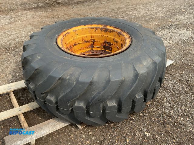 Lot 2-40174 - United Power Traction Size 20.5-25 Loader Tire on Steel 12-Lug Wheel, approx. 14.5" diameter center ...