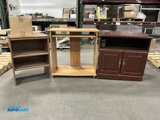 Lot 2-76777 - (3) brown wooden tables -(2)on wheels- and box of candle sticks