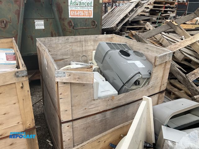Lot 2-27292 - Wooden crate full of various brands of air conditioners and box fans include it brands like haier an...