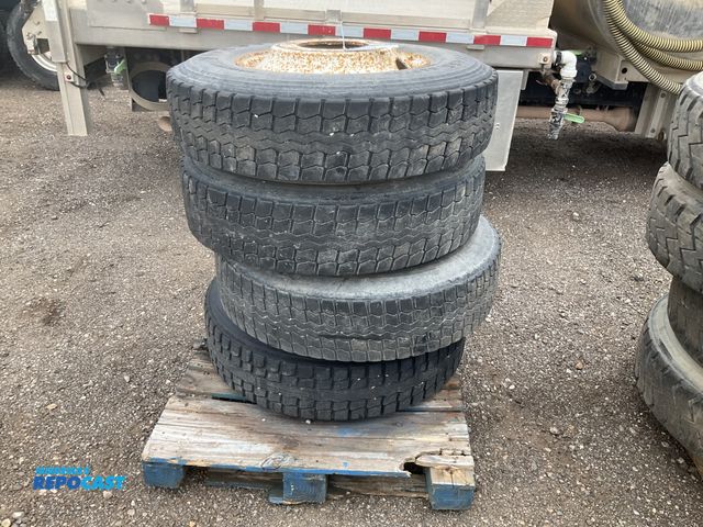 Lot 2-11829 - (4) recap 295/75R22.5 semi tires on steel wheels, used