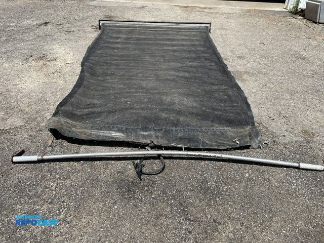 Lot 2-72739 - used spring loaded debris tarp, 84'' wide x 11' long, rear support bar not attached.