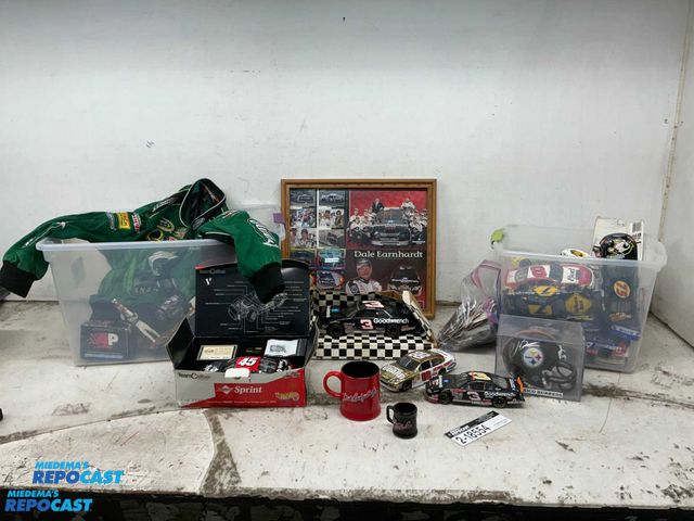 Lot 2-65814 - NASCAR diecast cars, 2XL Dale Jr. jacket, Dale Jr. picture frame, and Dale Jr. coffee mugs. Assorted...