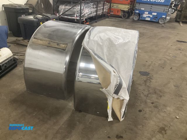 Lot 2-11555 - (1) new and (1) used stainless steel semi truck single axle fenders