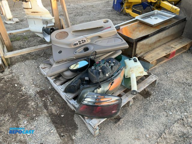 Lot 2-33011 - car parts for a 04 pontiac including interior car doors, side mirrors, a tank, car lights and window...