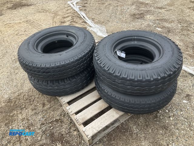 Lot 2-11562 - (4) 8-14.5 tires on steel mobile home style wheels, used