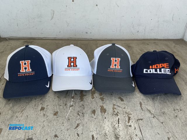 Lot 2-76313 - Lot of sport jerseys and caps