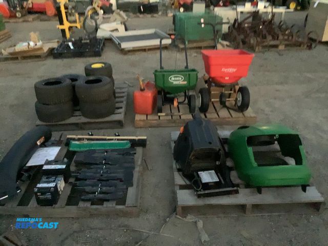 Lot 2-68791 - (2) Skids of assorted lawnmower parts, walk behind fertilizer spreader, and backrack headache rack
