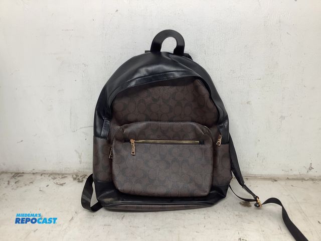 Lot 2-74017 - New Coach west Charlie leather backpack, two pockets, signature design, dark brown and black