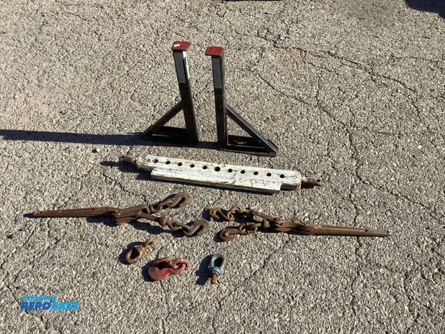 Lot 2-35708 - Lot of farming supplies including 9-hole drawbar, ladder jacks, and load binders.