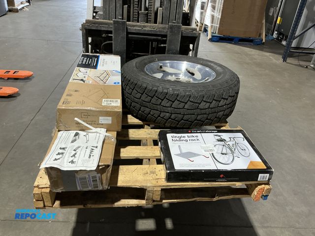 Lot 2-78778 - Pallet of Miscellaneous Merchandise Including a Tire-on-Rim- 265/70R17, Bike Rack, Bed Frame, &amp; ...