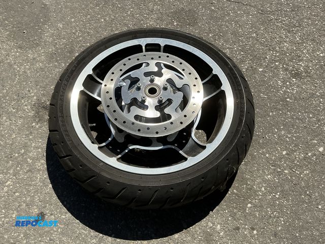 Lot 2-34759 - 19” front wheel and tire w/ rotors from 2013 street glide