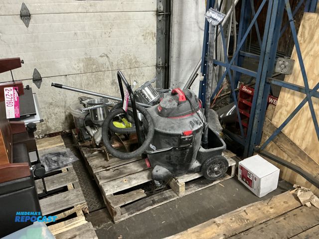 Lot 2-27159 - Skid lot of a shop-vac, broom, (6) light fixtures, hole diggers, hand powered Hole drill, (2) car bu...