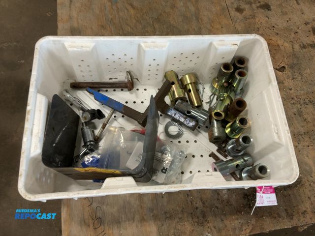 Lot 2-20101 - Tote of assorted items including mostly quick hitch bushings