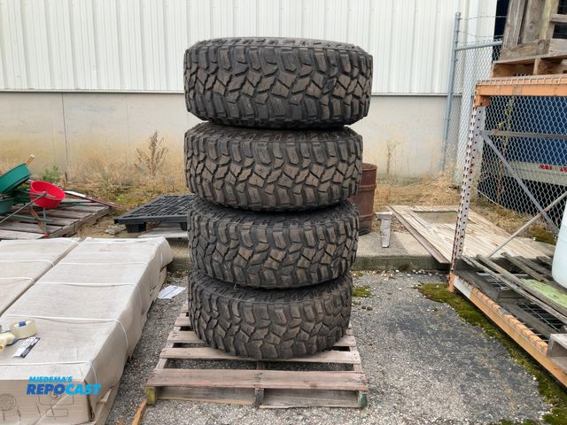 Lot 2-18790 - (4) Cooper Discoverer STTPro Mud terrain tires with rims, 8x180 bolt pattern, fits 2011-present Chev...