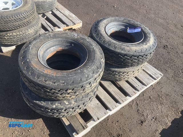 Lot 2-33617 - (4) 8-14.5 tires on steel mobile home wheels, used