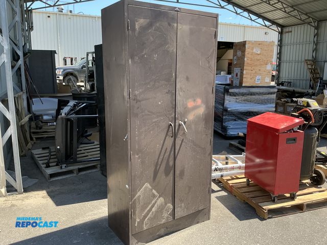 Lot 2-62395 - One brown cabinet locker measuring 36" x 18" x 78". Dent in bottom and locker has been
painted befor...
