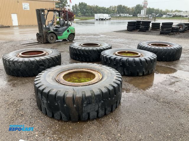 Lot 2-41555 - (5) 21.00-35 tires on steel split rims, used, showing wear and cracking