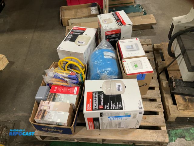 Lot 2-93543 - skid of water heater, installation parts, ballast tanks, flex lines, thermostats, water heater timer