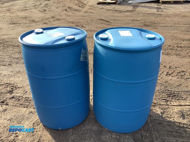 Lot 2-15241 - 2 55 gallon plastic barrels with 2 removable bungs, contained molasses