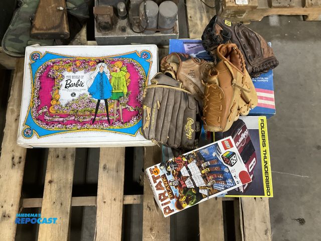Lot 2-69179 - Misc. group lot includes: (4) baseball gloves, Lego pirate plank, the world of Barbie double doll ca...