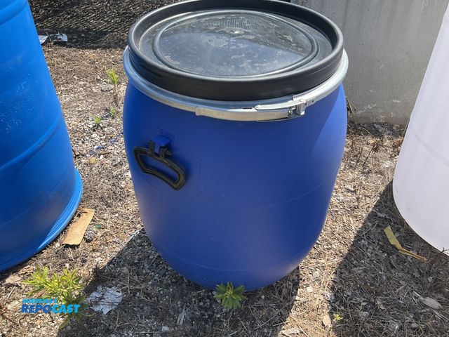 Lot 2-99357 - 25 gallon blue plastic barrel w/ removable &amp; locking ring - contained a food product